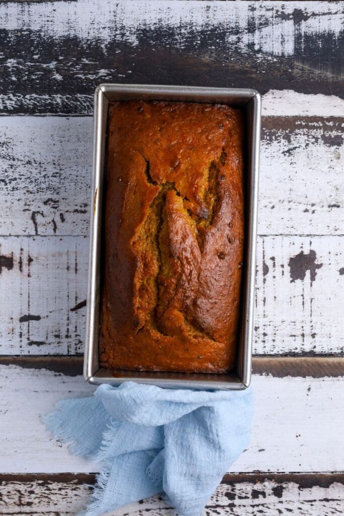 A loaf of sourdough pumpkin banana bread freshly baked and taken out of the oven.