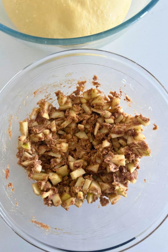 Mixed apple filling for sourdough apple cinnamon rolls in bowl.