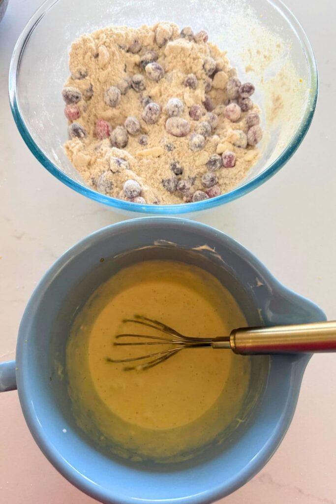 Mixing wet ingredients for sourdough orange and cranberry scones.