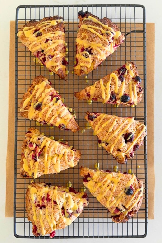 Sourdough orange and cranberry scones on cooling rack.