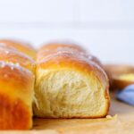Side view of a sourdough discard honey butter rolls.