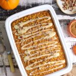 Fresh baked sourdough pumpkin pie baked oatmeal in baking dish with glaze on top.