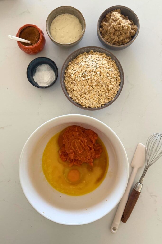 Wet ingredients in bowl ready for mixing to make batter for sourdough pumpkin pie baked oatmeal.