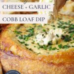 An image of a sourdough cheese and garlic cobb loaf dip with a handing dipping bread into and text overlay for a Pinterest Pin.