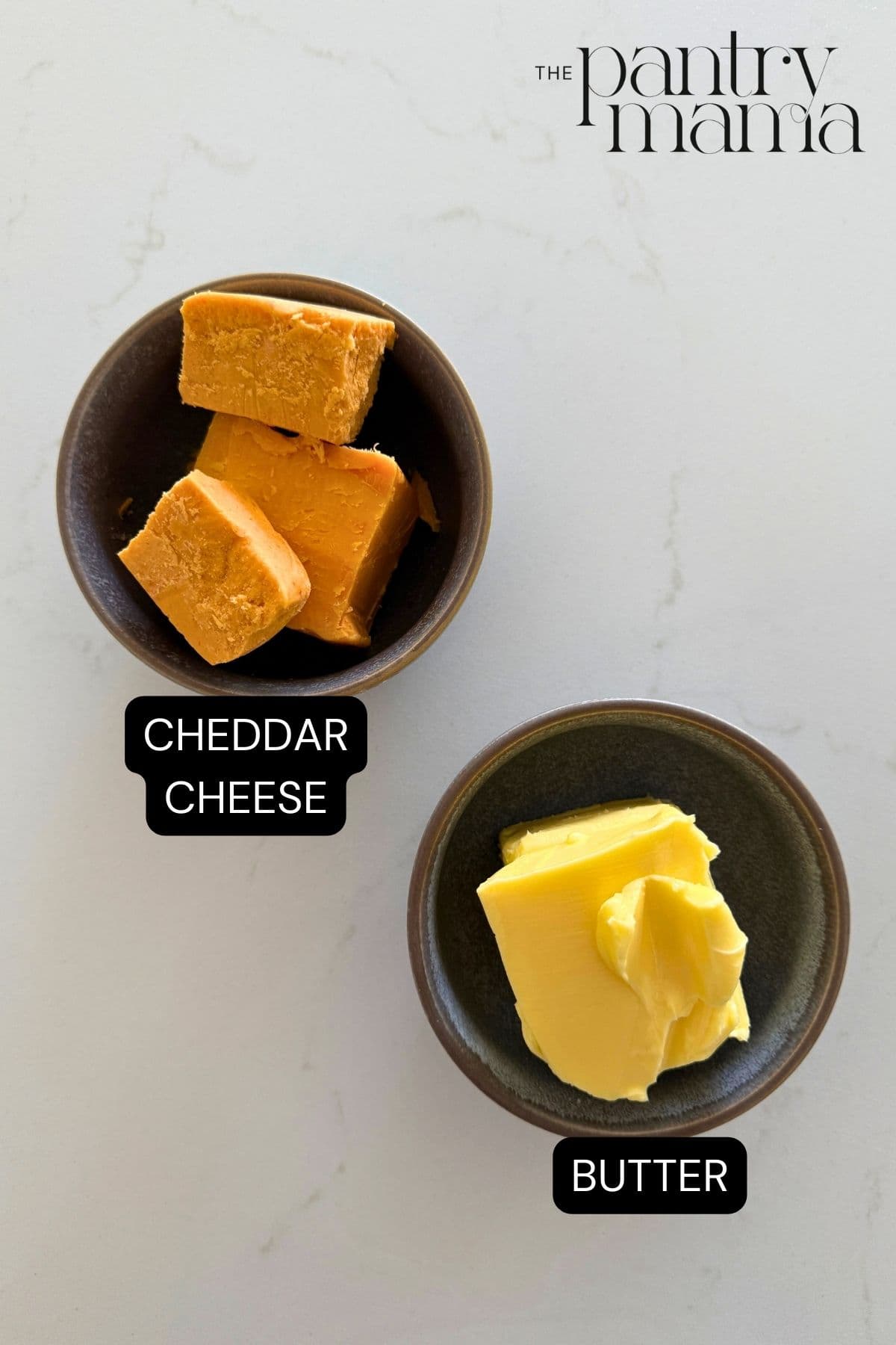 Labeled ingredients on the counter to make cheddar butter.
