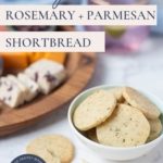 Sourdough discard rosemary and parmesan shortbread in a bowl with a cheese board in background and text overlay on the image for a Pinterest Pin.