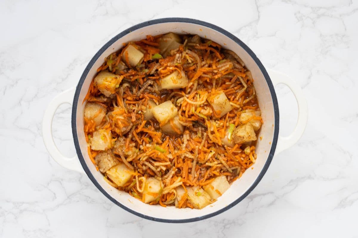 Ingredients for carrot cake jam in a pot to make a fresh batch.