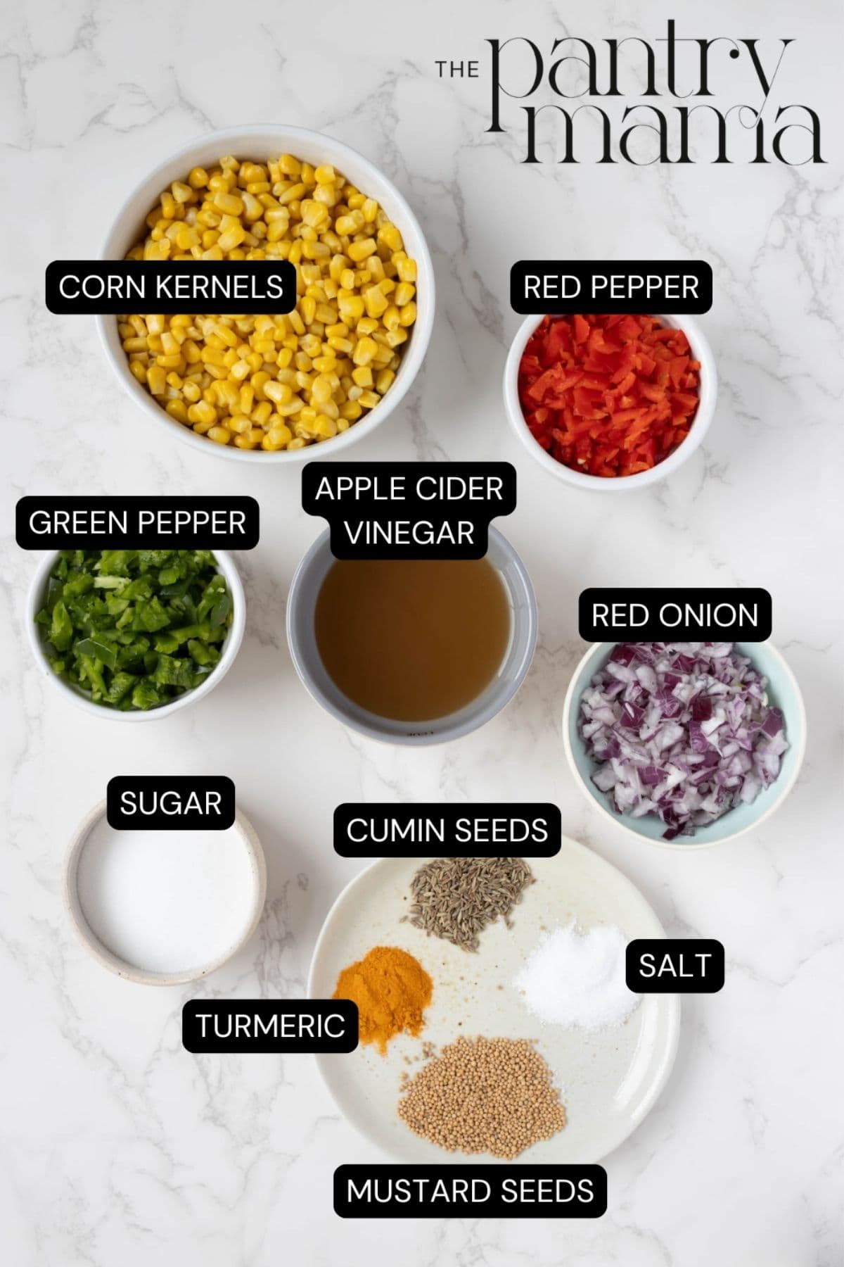 Labeled ingredients on the counter to make corn relish.