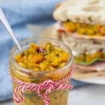Image of mustard relish in a jar with text overlay for a Pinterest pin.