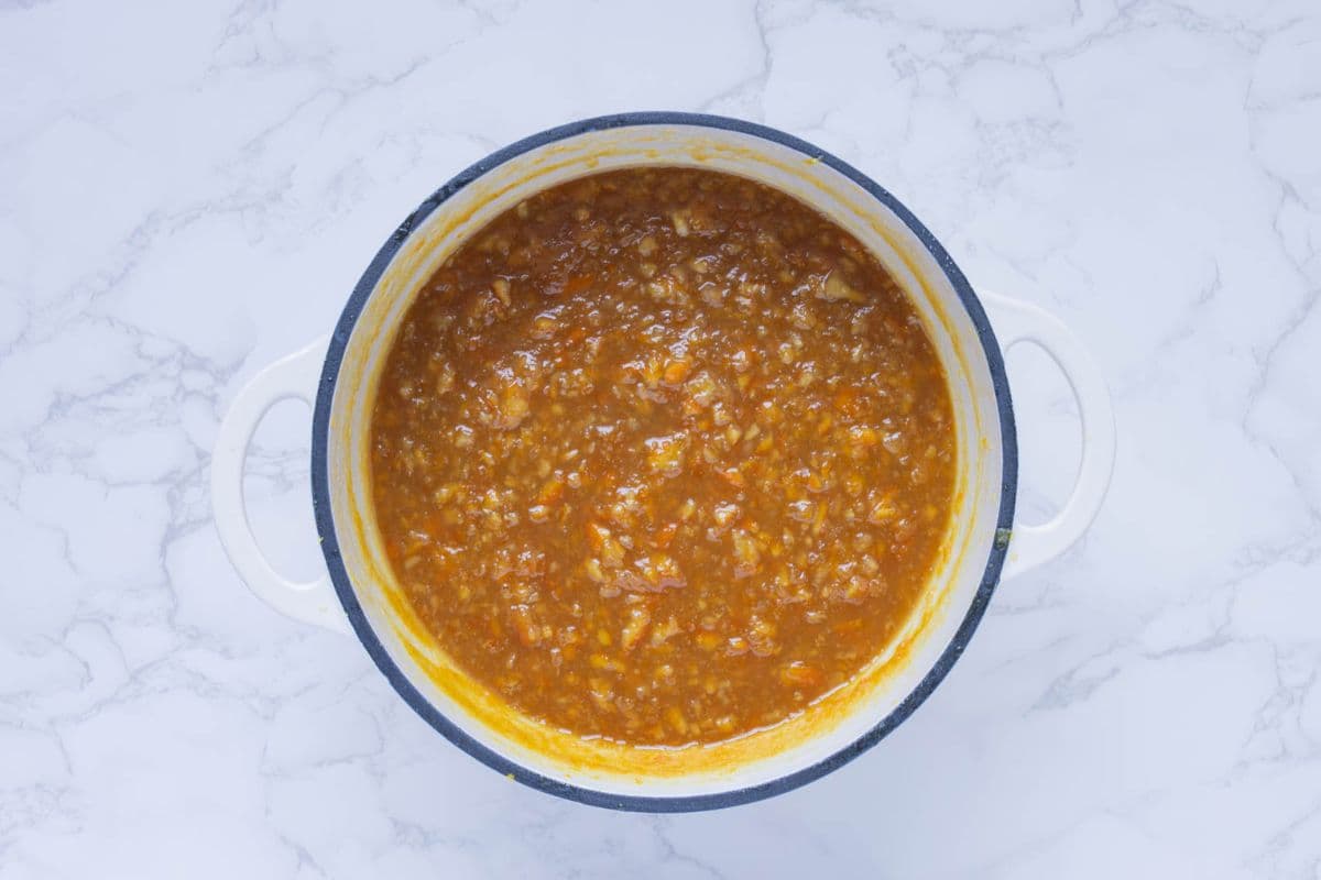 A pot of orange marmalade after all ingredients have been cooked down.