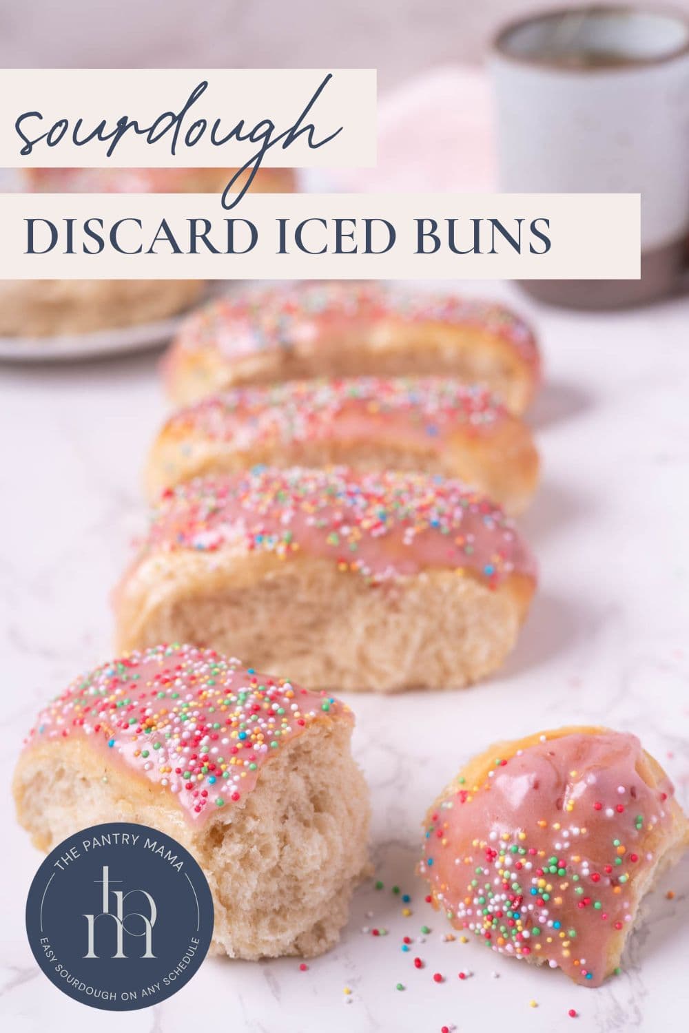 Sourdough discard iced buns on the counter with text overlay for a Pinterest Pin image.