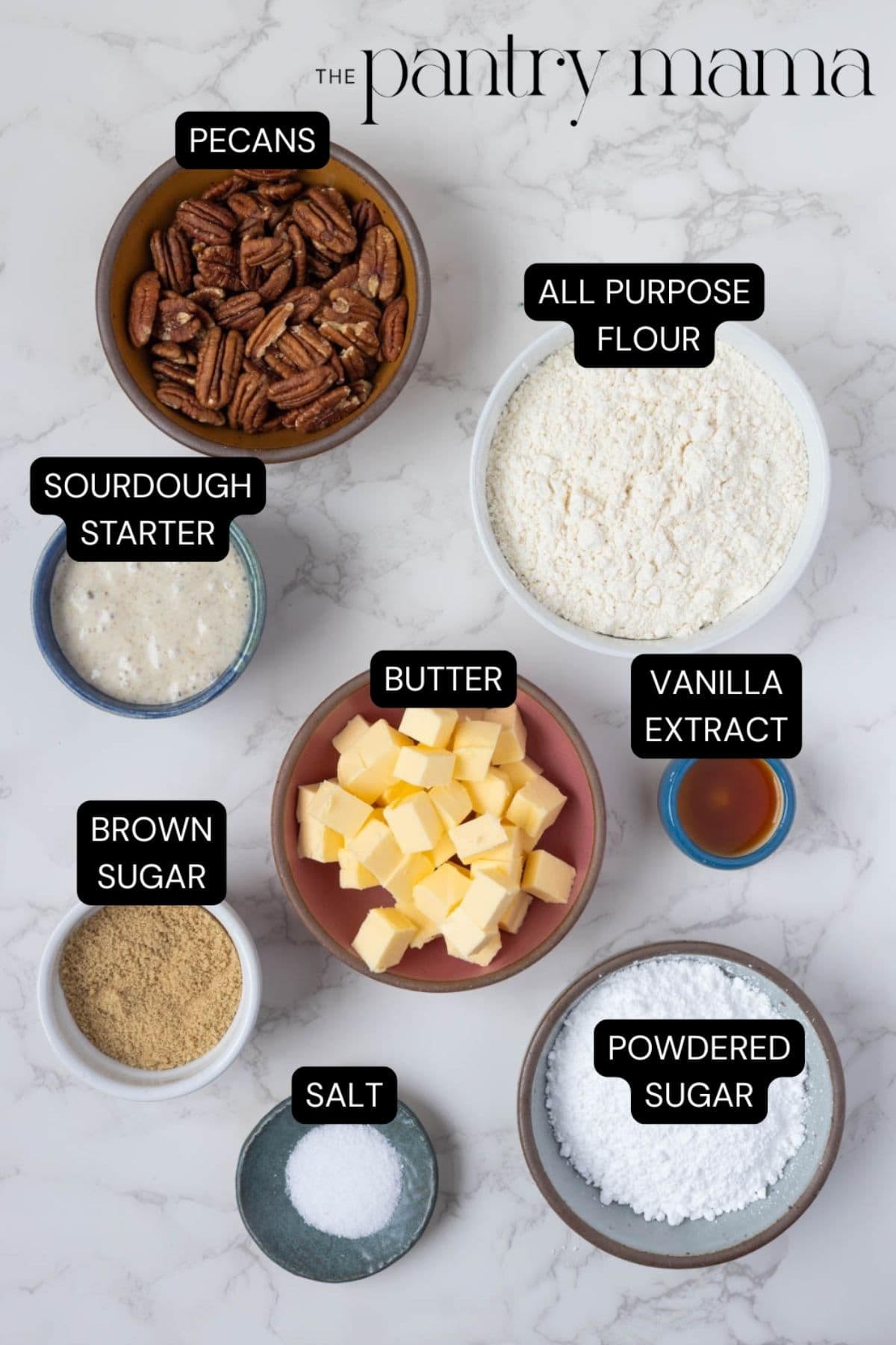 Labeled ingredients on counter to make sourdough discard pecan sandies.