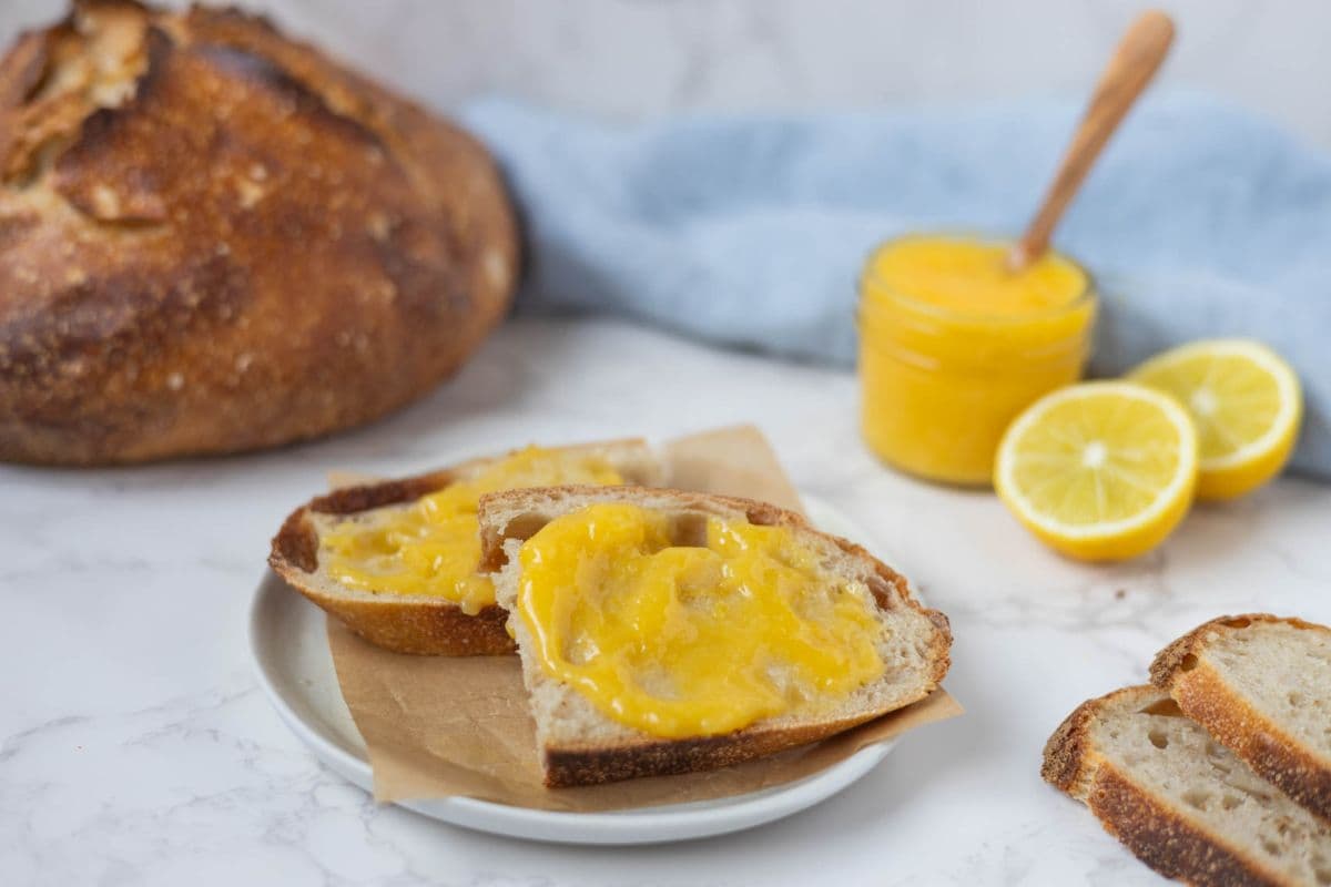 Close up of toast topped with fresh lemon curd.