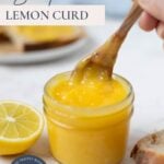 Scooping out lemon curd from a jar with text overlay for a Pinterest Pin image.