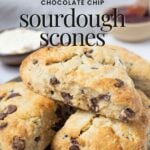Stacked sourdough chocolate chip scones on a plate with text overlay reading chocolate chip sourdough scones for Pinterest Pin.