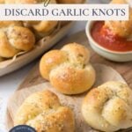 Sourdough discard garlic knots on a wood platter with sauce and text overlay for a Pinterest image.