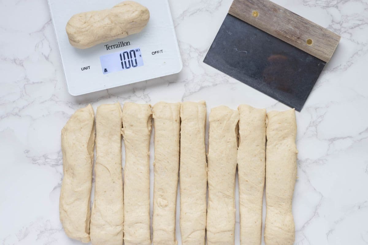 Portioning out and weighing the dough to make sourdough discard iced buns.