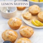 Sourdough lemon muffins with lemon glaze arranged on a countertop with lemon slices and text overlay for a Pinterest Pin.