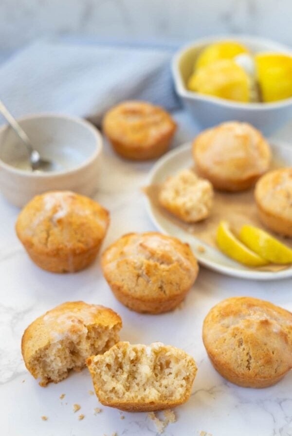 Sourdough lemon muffin broken open to show the soft crumb inside.