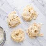 Sourdough pasta pieces on counter ready to dry.