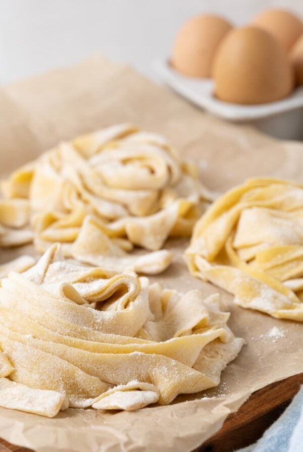 Fresh made sourdough pasta on parchment paper.