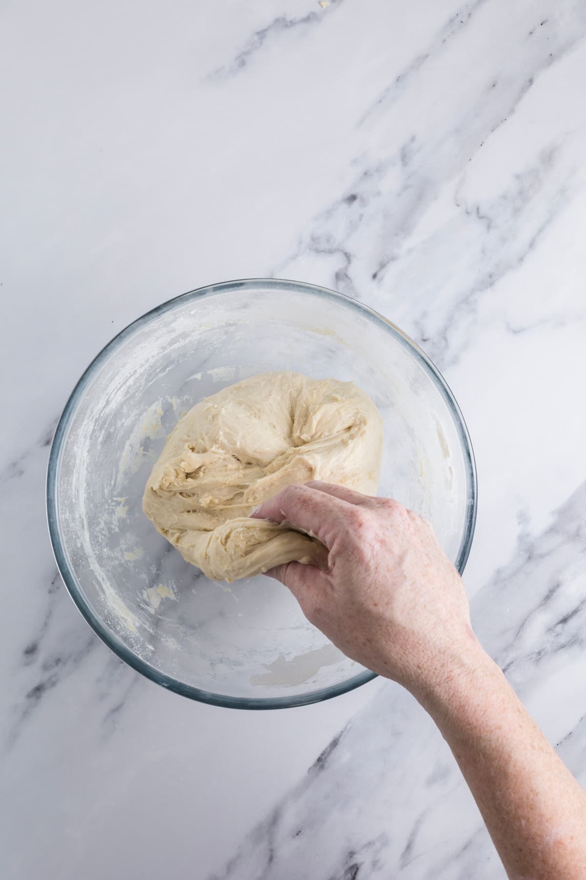 Starting to perform stretch and folds with the sourdough honey oat bread dough.