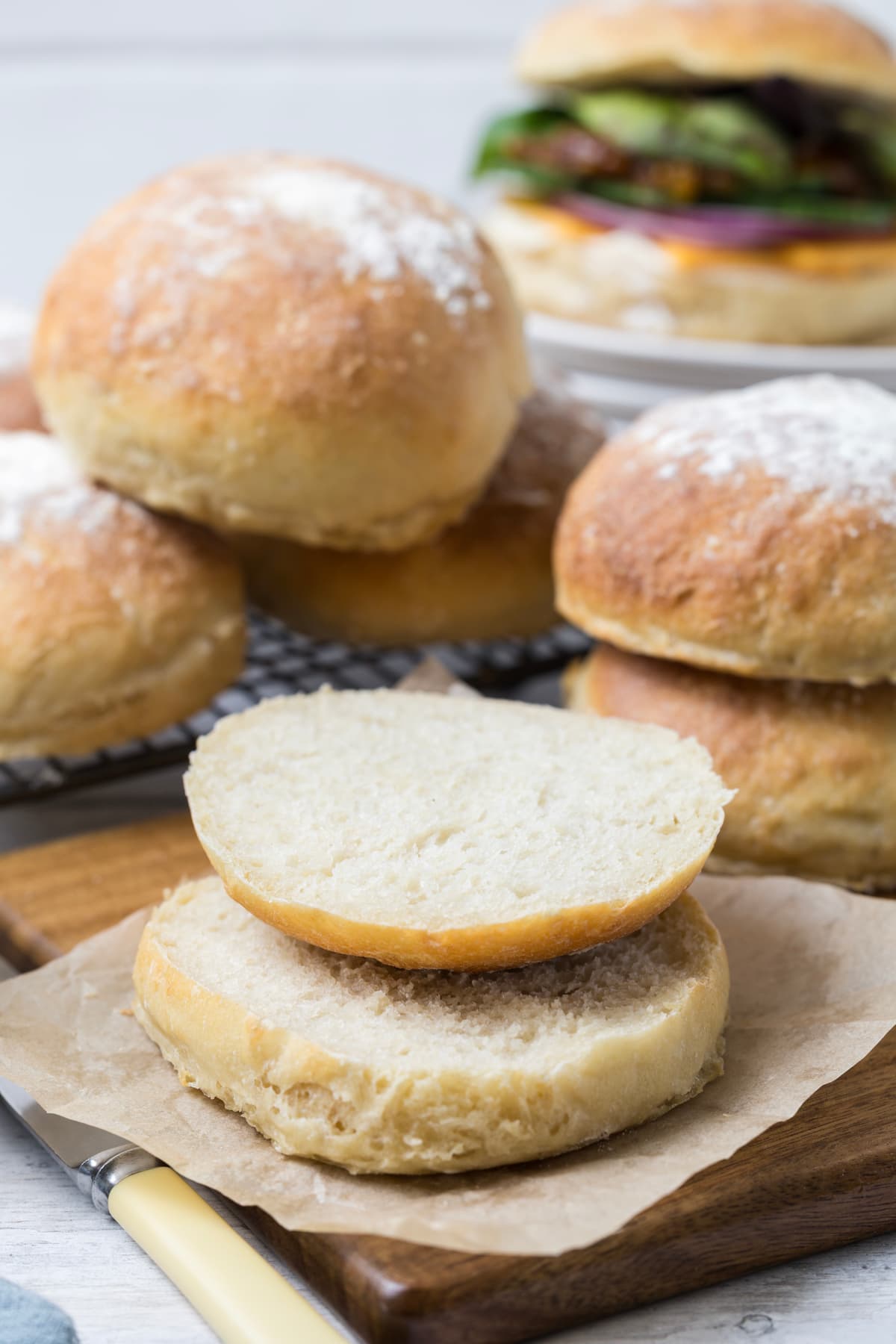A sourdough discard roll sliced open to make a sandwich.