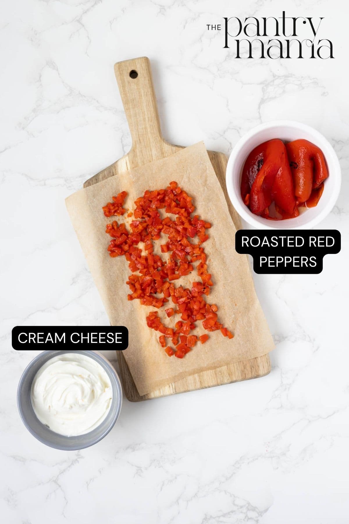 Labeled ingredients on the counter for roasted red pepper cream cheese dip spread.