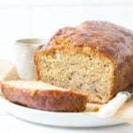 A loaf of sourdough discard banana bread sliced open to show inside texture.