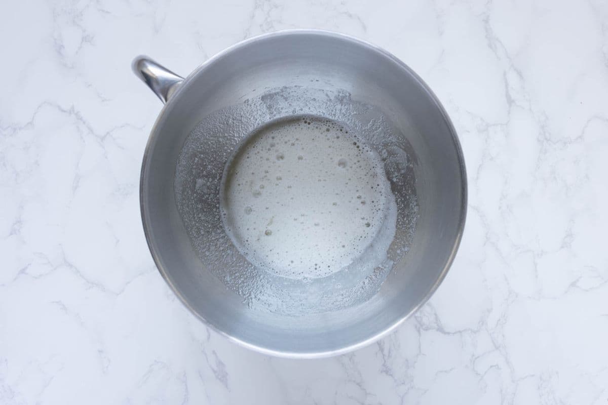 Mixing egg whites with sugar to make batter for sourdough fortune cookies.