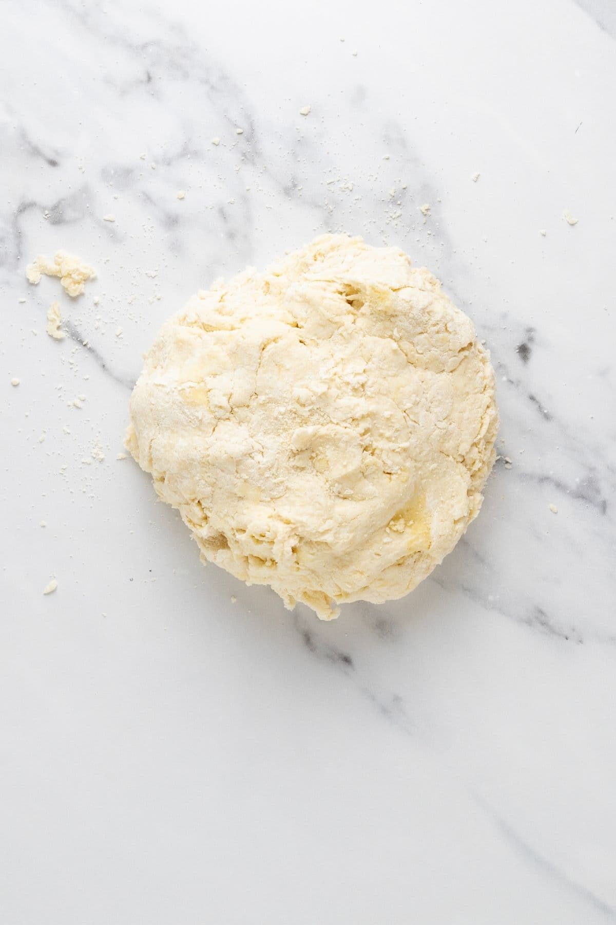A ball of sourdough parchment cracker dough on the counter just before fermentation.