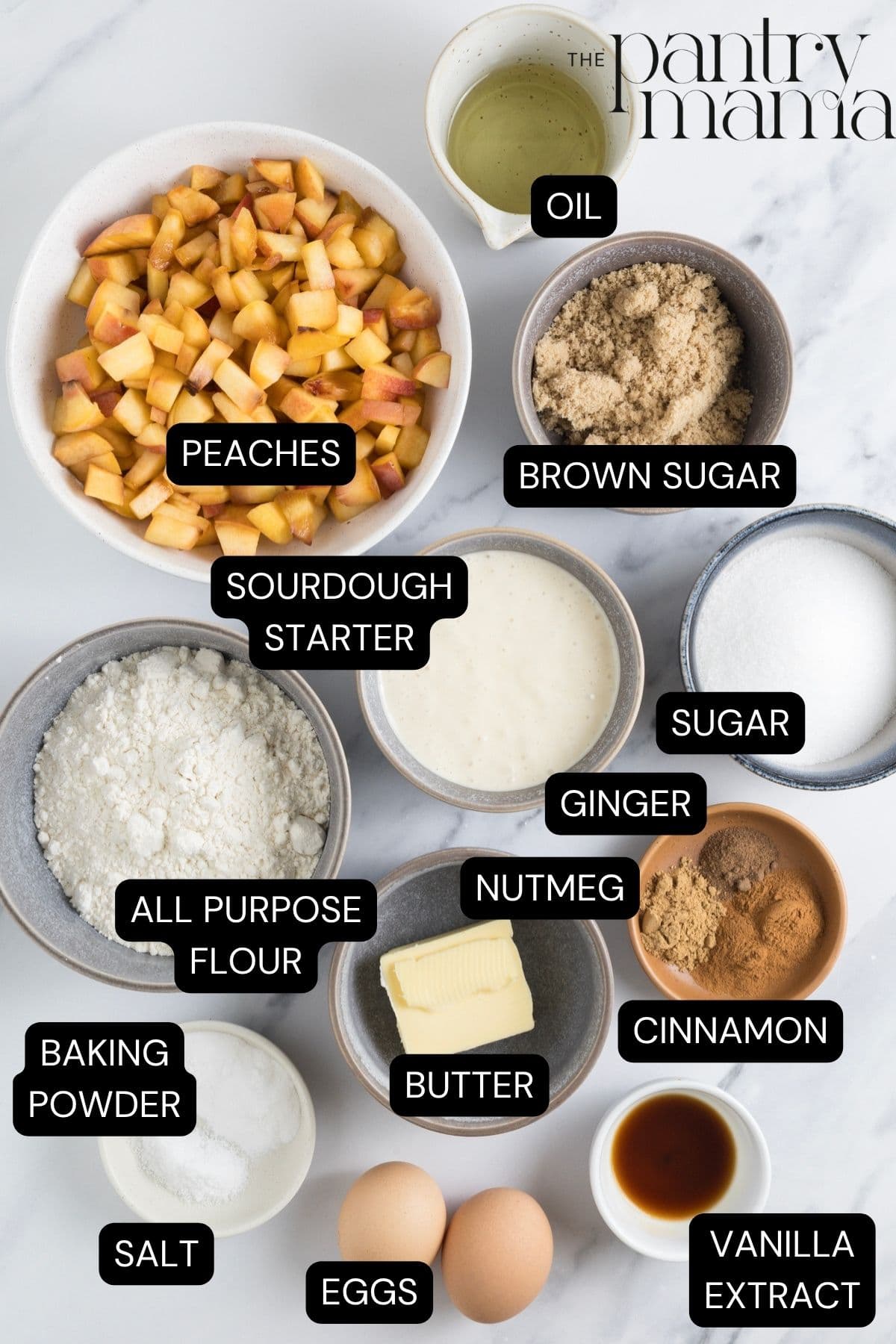 Labeled ingredients on the counter to make sourdough peach cobbler muffins.