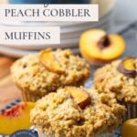Close up image of sourdough peach cobbler muffins cooling on a wire rack with text overlay for a Pinterest Pin image.