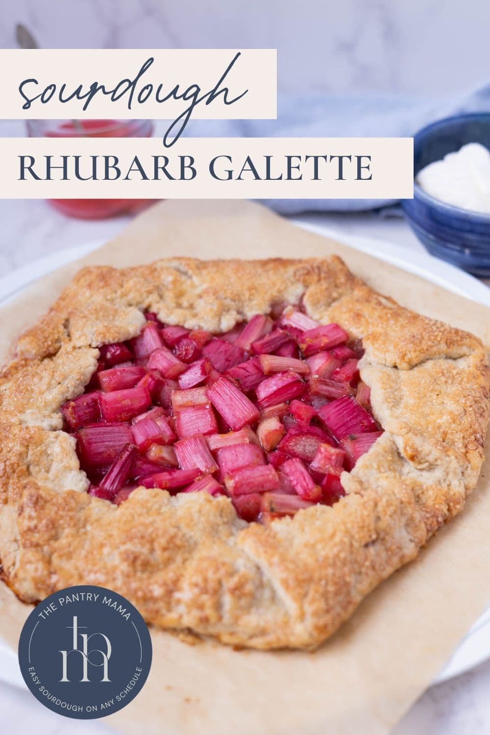 Close up of a sourdough rhubarb galette on a serving plate with text overlay for a Pinterest Pin.