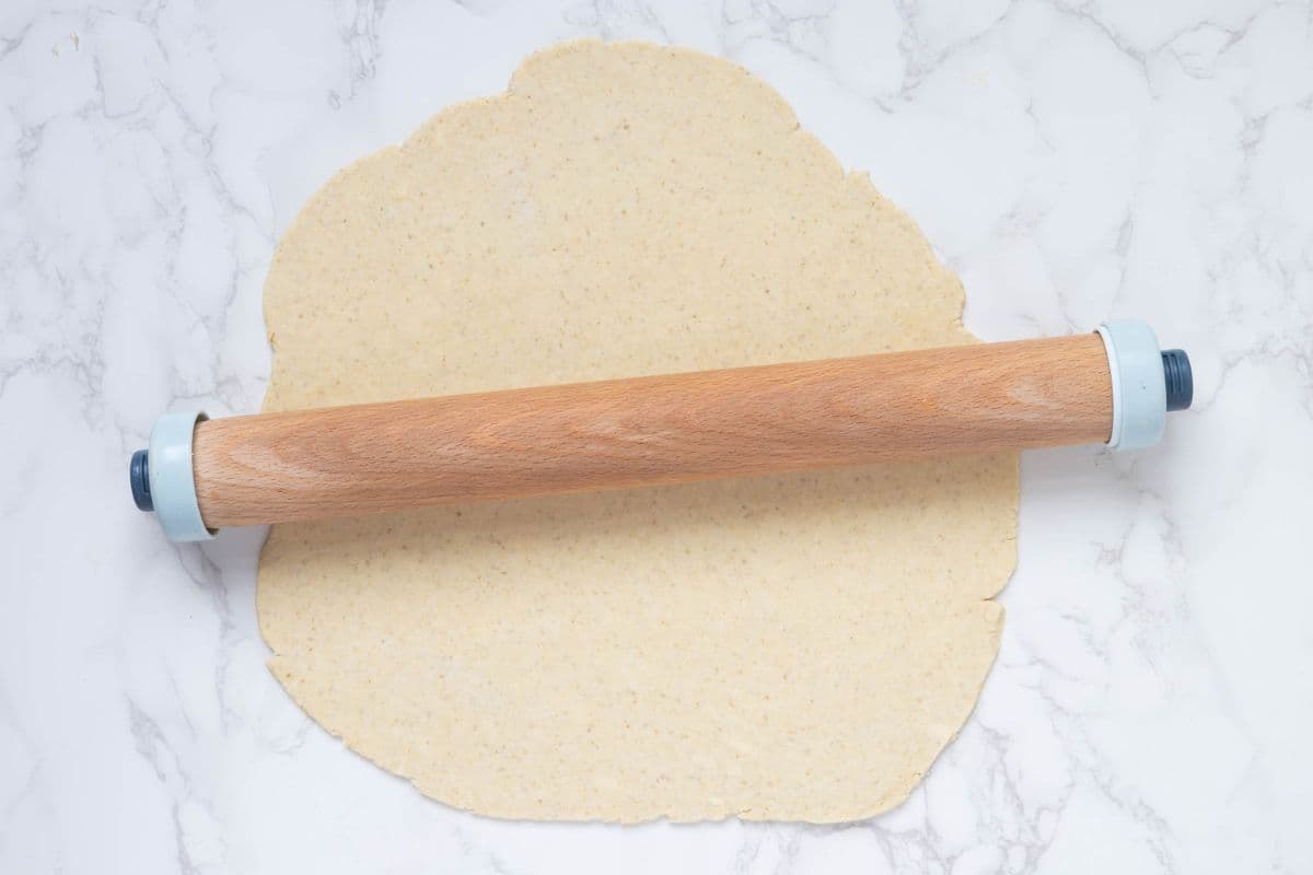 Rolling out chilled dough to make a sourdough rhubarb galette.