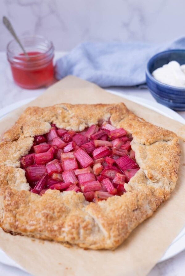 A side view of a sourdough rhubarb galette to show golden crust texture.