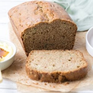 Close up of a loaf of sourdough zucchini bread sliced open to show inside texture.
