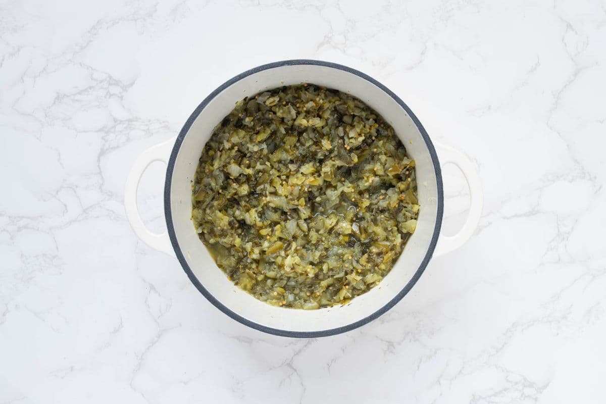 Fully cooked dill pickle relish in pot.