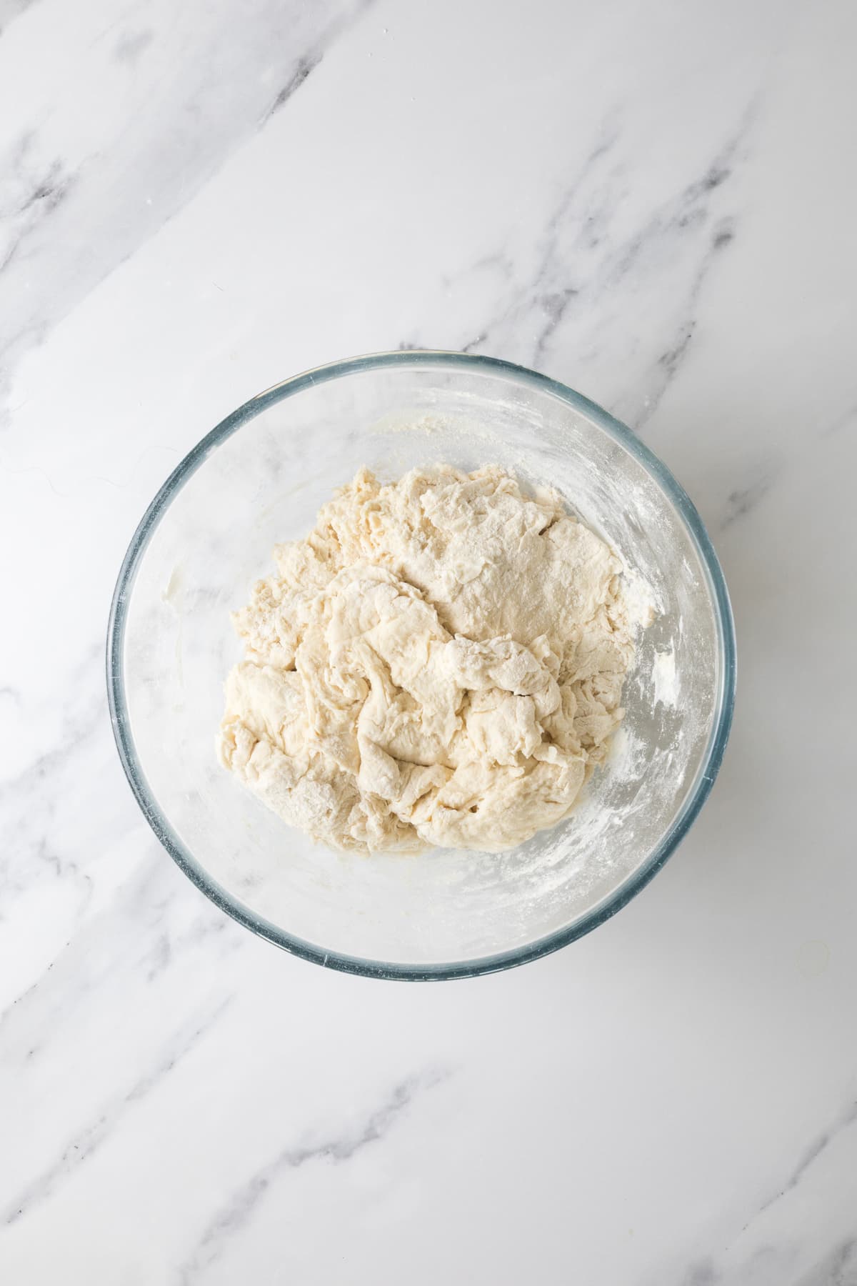 Freshly mixed overnight sourdough bread shaggy dough before resting and folding.