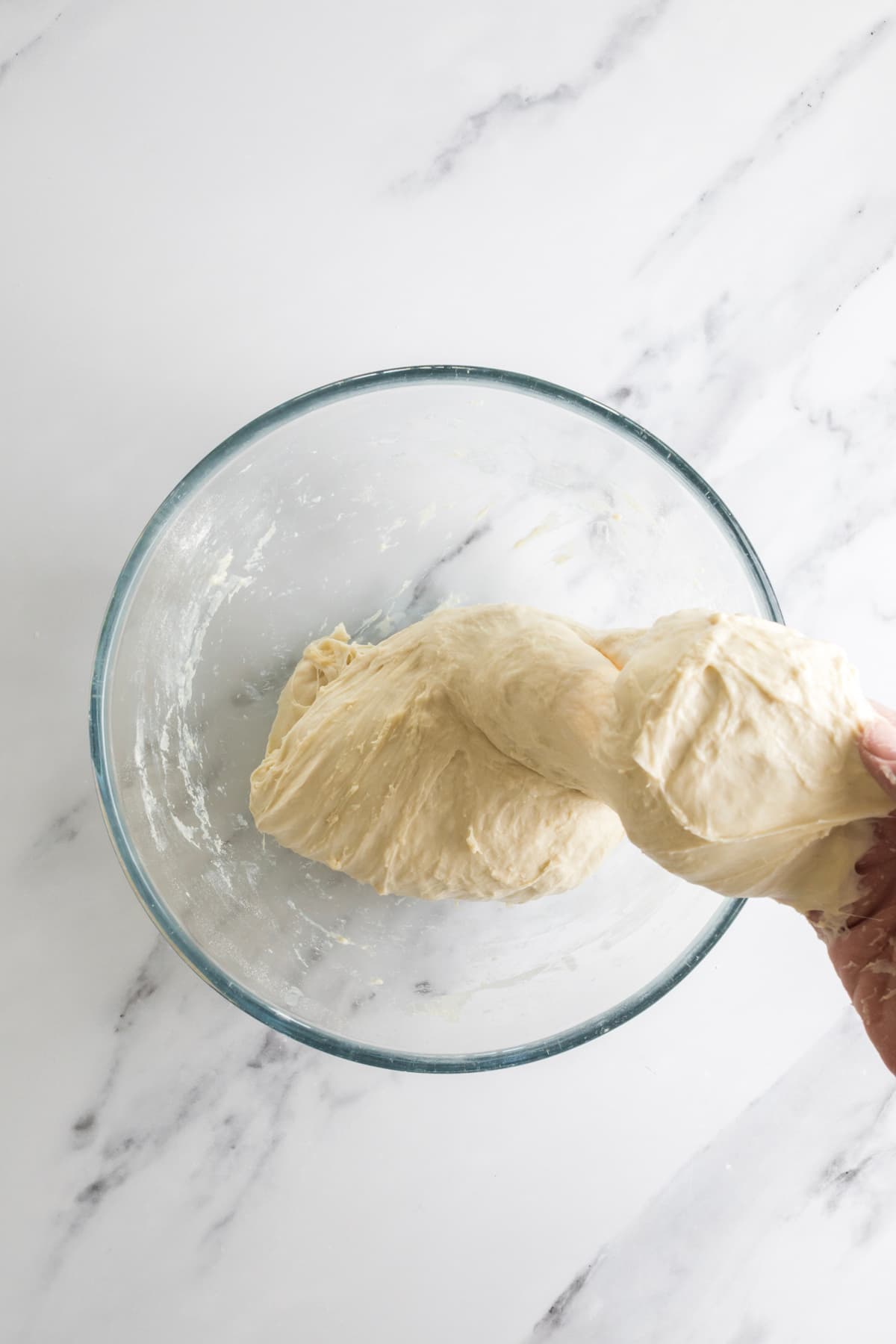Overnight sourdough bread dough during an early stretch and fold step.