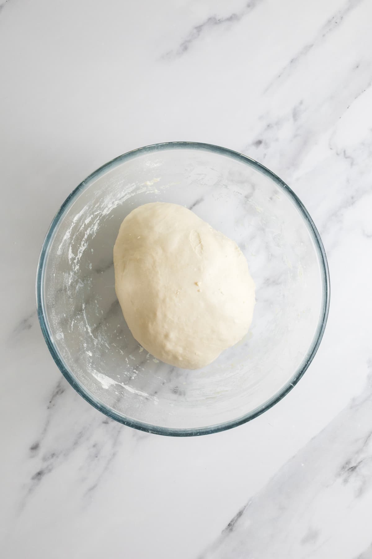 Overnight sourdough bread dough resting in a bowl before proofing.