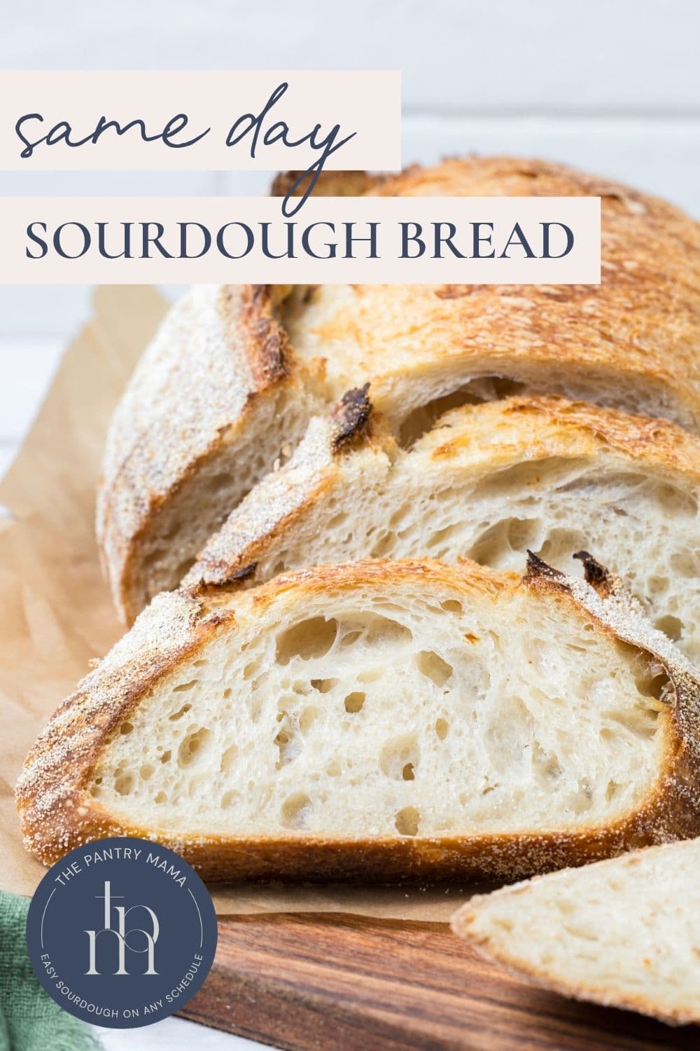 Same day sourdough bread sliced on a wooden board with text overlay showing an easy same day sourdough recipe.