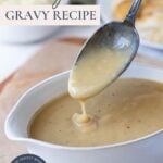 Pinterest graphic for sourdough gravy recipe with creamy gravy dripping from a spoon.