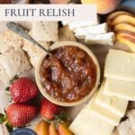 Pinterest image with text overlay for summer fruits relish featuring a bowl of fruit relish with sourdough crackers, peaches, strawberries, and cheese.