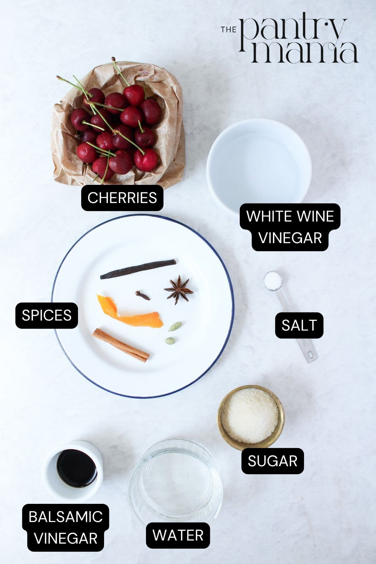 Labeled ingredients to make sweet pickled cherries.