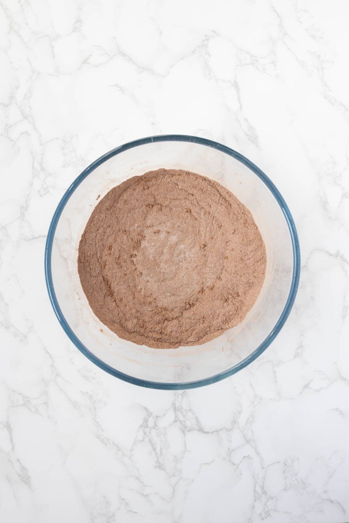 Dry ingredients mixed together in a bowl for sourdough chocolate brownie bites.