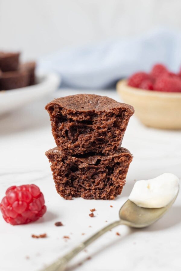 Stacked sourdough chocolate brownie bites showing the rich, fudgy texture inside.