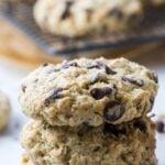 Stack of soft and chewy protein sourdough chocolate chip cookies on the counter with text overlay for a Pinterest Pin image.