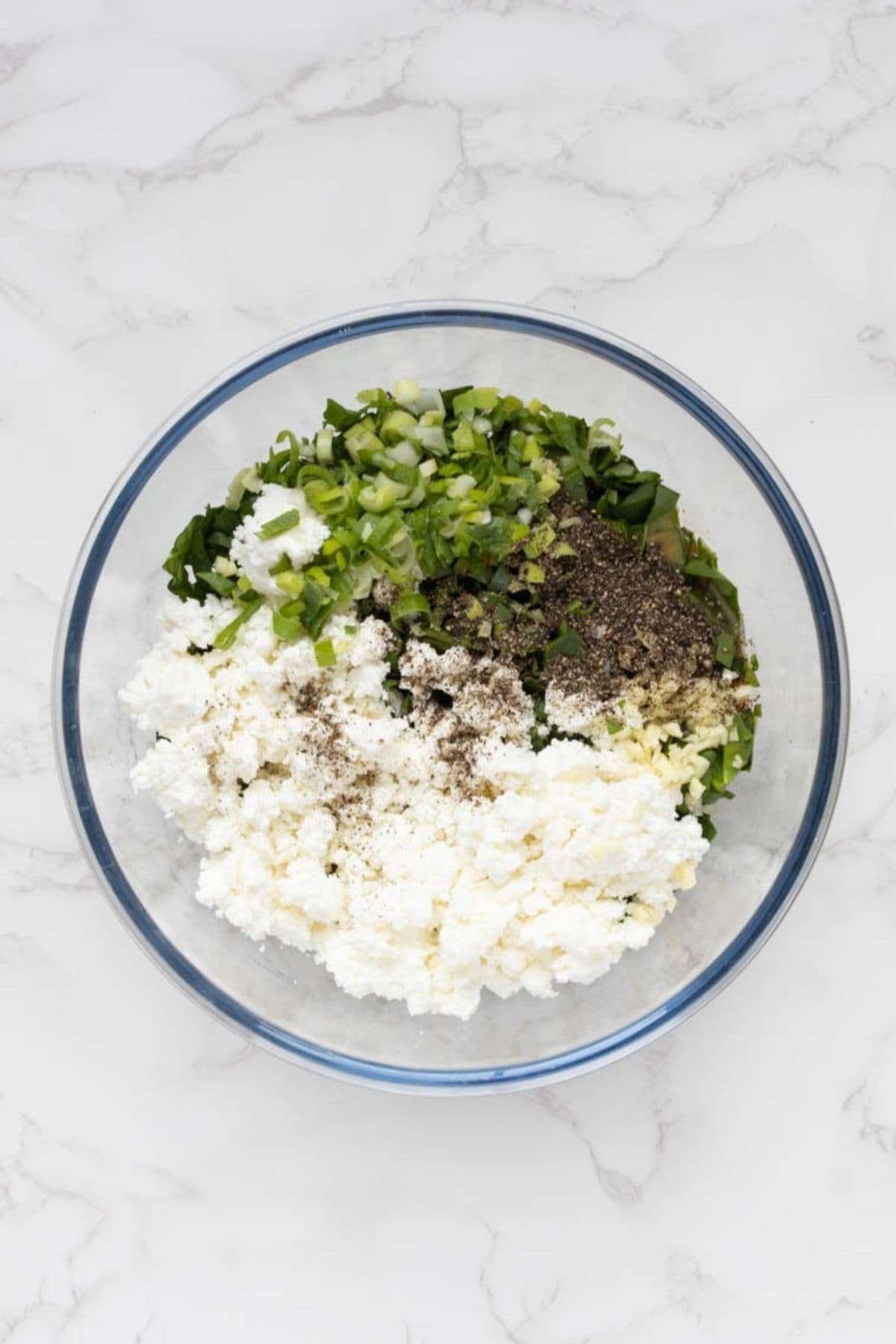 Spinach, feta cheese, scallions, garlic, and seasonings combined to make gozleme filling.