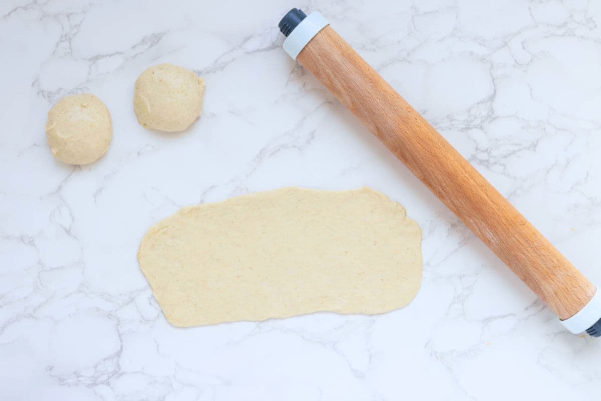 Portion of sourdough gozleme dough rolled into a rectangle ready for filling.